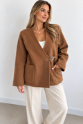Cognac brown wool and cashmere jacket with buckle closure and two front pockets, worn with cream trousers – Darivé Select